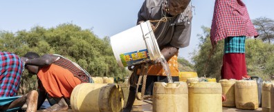 Sitat Parmuat pooring water at water point