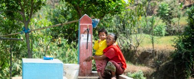 Mani Tamang with her grand daugher at a water pump